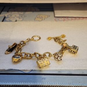 Juicy Couture Gold Bracelet with Black and Silver Charms